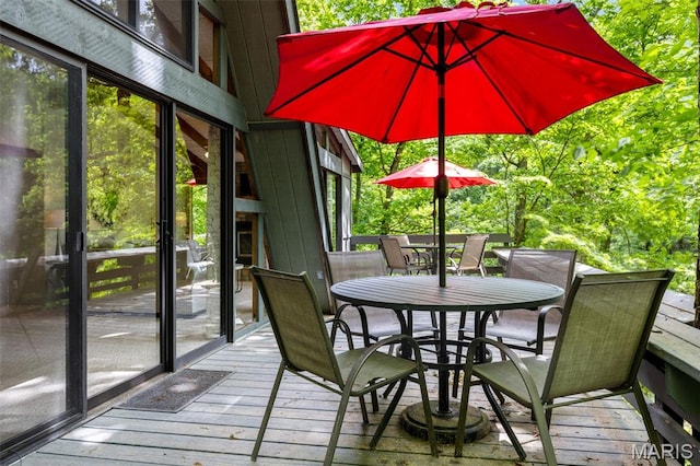 1235 Powderhorn Dr, Innsbrook, MO 63390 - wooden terrace with outdoor dining area
