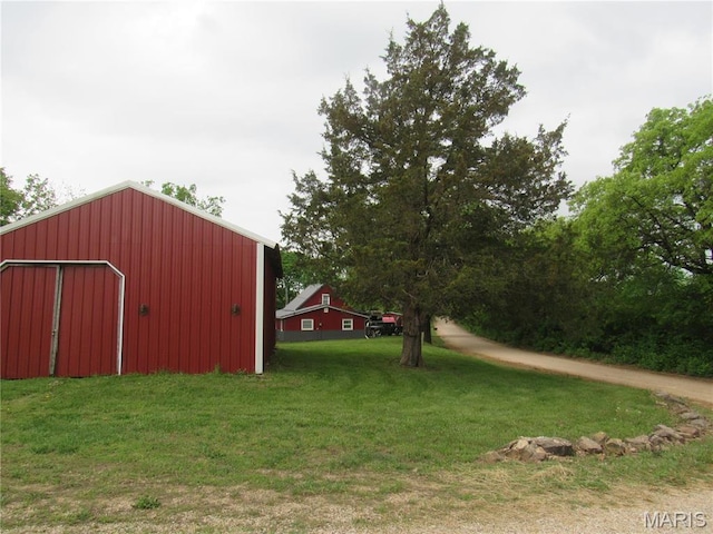 2375 Argo Rd, Cuba, MO 65453 - view of grassy yard with a pole building, an outbuilding, and a detached garage