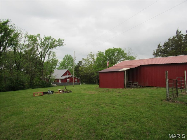 2375 Argo Rd, Cuba, MO 65453 - view of green lawn featuring a pole building and an outdoor structure