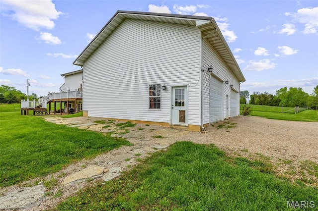 802 Hager Rd, Farmington, MO 63640 - rear view of house featuring a garage, a wooden deck, and gravel driveway