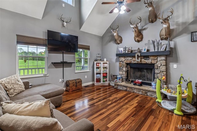 802 Hager Rd, Farmington, MO 63640 - living area featuring high vaulted ceiling, wood finished floors, ceiling fan, a fireplace, and baseboards