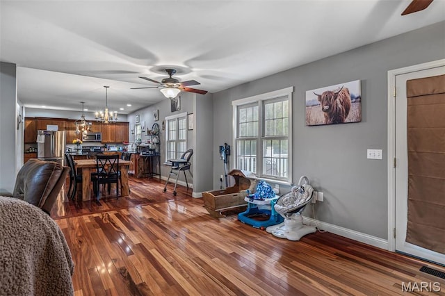 802 Hager Rd, Farmington, MO 63640 - living area featuring a ceiling fan, baseboards, and dark wood-type flooring