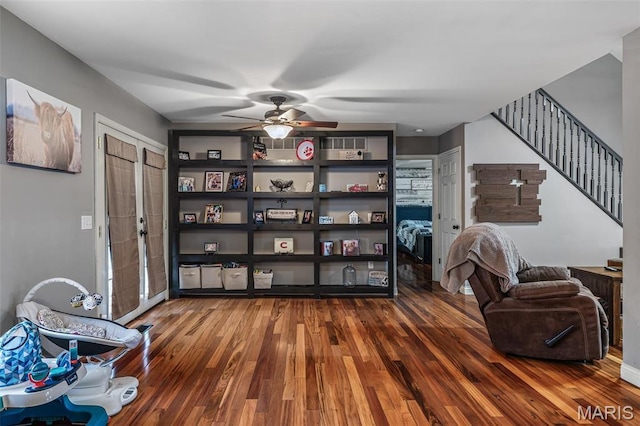 802 Hager Rd, Farmington, MO 63640 - living area featuring wood finished floors, ceiling fan, and stairway