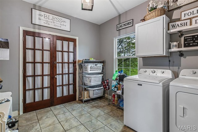802 Hager Rd, Farmington, MO 63640 - washroom with cabinet space, washing machine and clothes dryer, french doors, and light tile patterned flooring