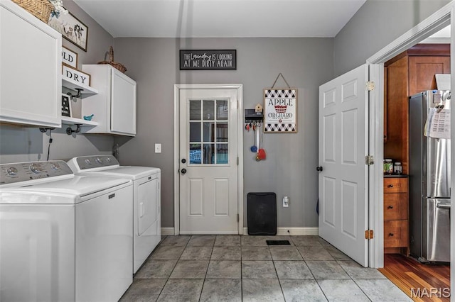 802 Hager Rd, Farmington, MO 63640 - laundry room featuring cabinet space, separate washer and dryer, and baseboards