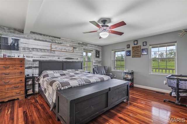 802 Hager Rd, Farmington, MO 63640 - bedroom featuring an accent wall, wood finished floors, baseboards, and a ceiling fan