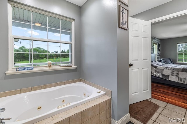 802 Hager Rd, Farmington, MO 63640 - bathroom with ensuite bath, a tub with jets, and tile patterned flooring