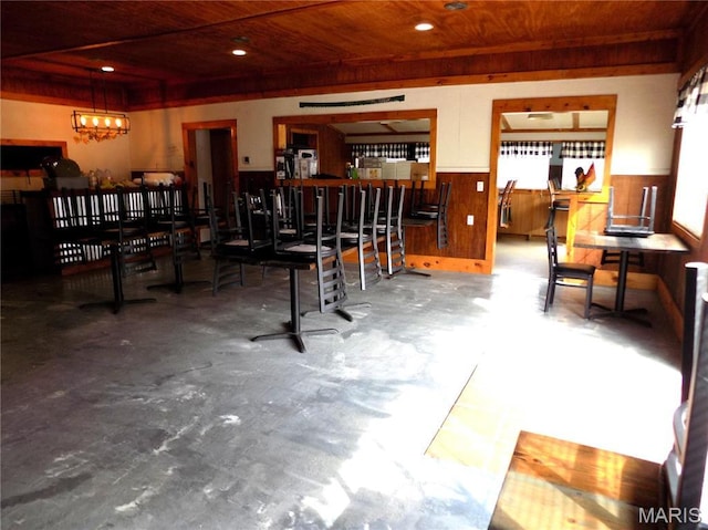491 Broadway St, Edgar Springs, MO 65462 - bar area with wainscoting, concrete floors, wooden ceiling, recessed lighting, and wood walls