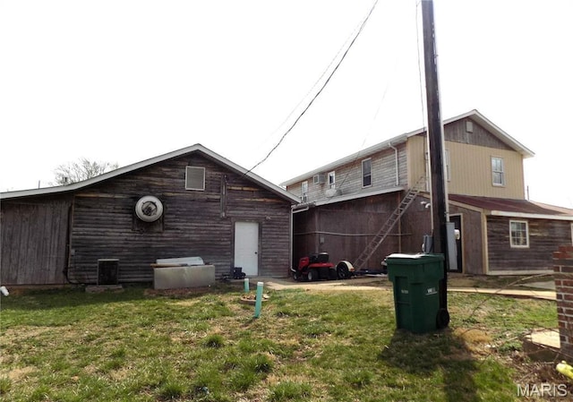 491 Broadway St, Edgar Springs, MO 65462 - back of house with a yard and central AC unit