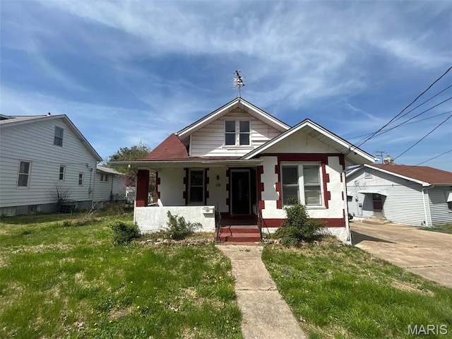 339 Midridge Dr, Saint Louis, MO 63137 - bungalow featuring a porch and a front lawn