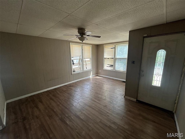 339 Midridge Dr, Saint Louis, MO 63137 - entryway with a paneled ceiling, a ceiling fan, baseboards, dark wood-type flooring, and wood walls