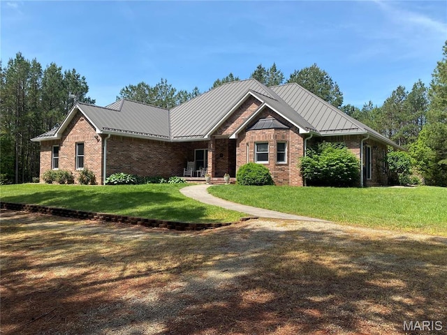 14035 County Road 4110, Rolla, MO 65401 - single story home featuring brick siding, a front lawn, a standing seam roof, and metal roof