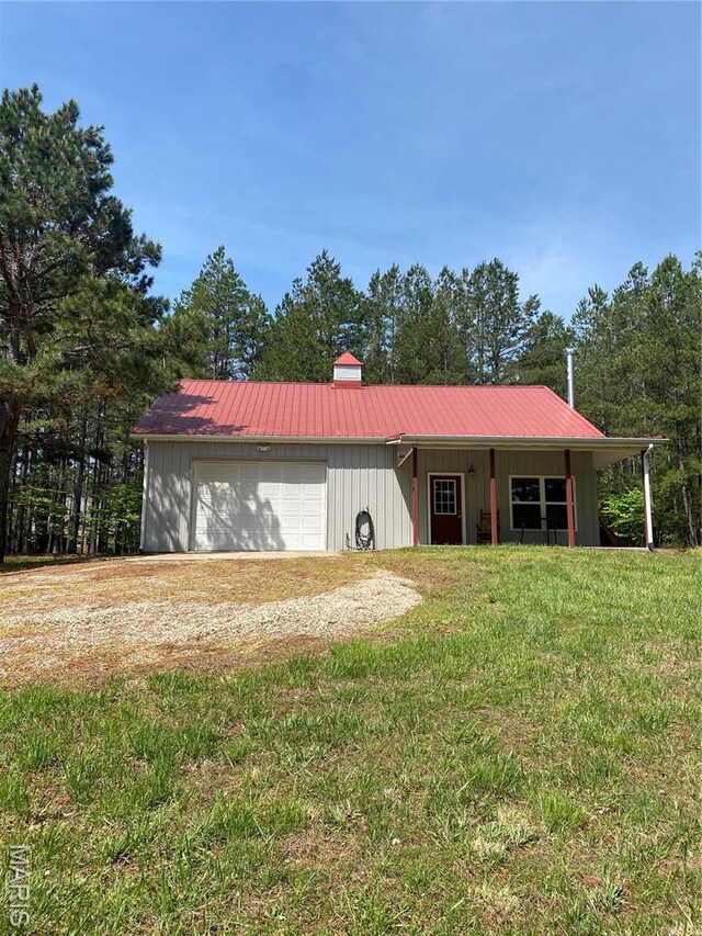 14035 County Road 4110, Rolla, MO 65401 - view of front of property with metal roof, a front lawn, and board and batten siding