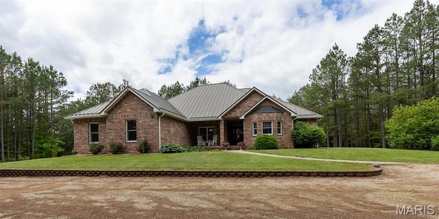14035 County Road 4110, Rolla, MO 65401 - craftsman inspired home featuring brick siding, a front lawn, a standing seam roof, and metal roof