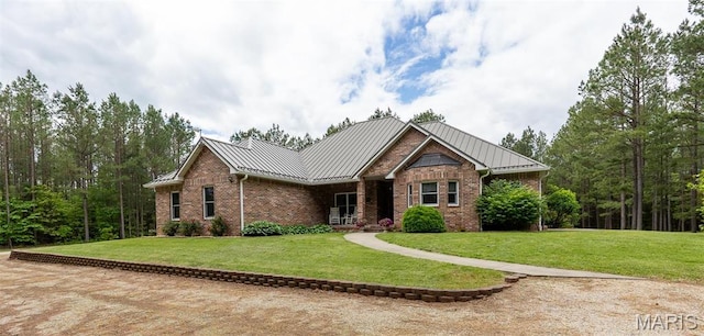 14035 County Road 4110, Rolla, MO 65401 - view of front of home featuring a standing seam roof, a front yard, and brick siding