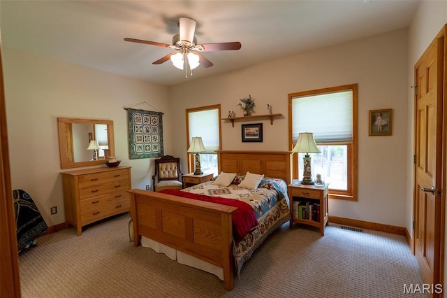 14035 County Road 4110, Rolla, MO 65401 - bedroom with light carpet, baseboards, and a ceiling fan