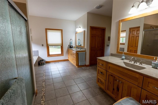 14035 County Road 4110, Rolla, MO 65401 - full bath featuring tile patterned flooring, a shower stall, and two vanities