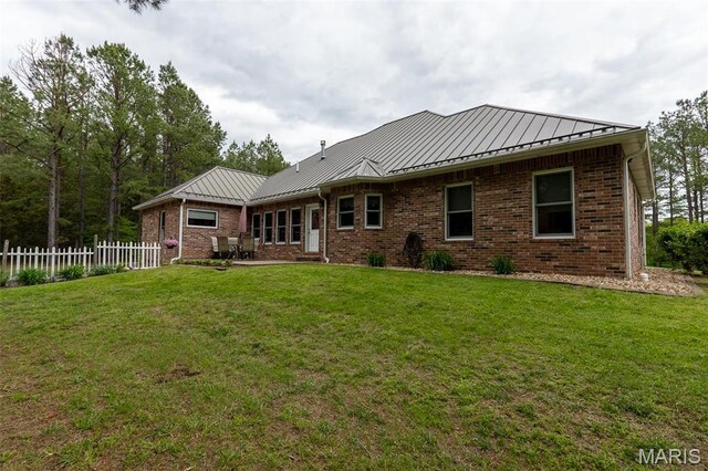 14035 County Road 4110, Rolla, MO 65401 - rear view of house with a standing seam roof, brick siding, and metal roof