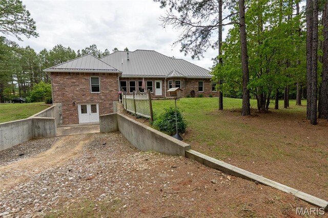 14035 County Road 4110, Rolla, MO 65401 - back of property with brick siding, a yard, metal roof, and driveway