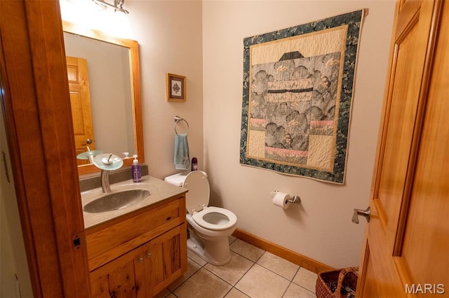 14035 County Road 4110, Rolla, MO 65401 - bathroom featuring tile patterned flooring, toilet, vanity, and baseboards