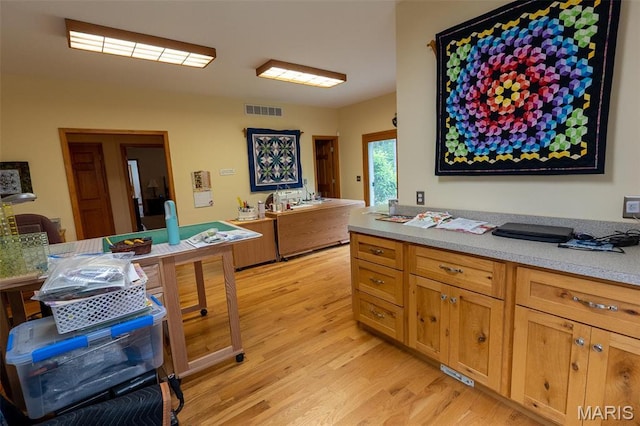 14035 County Road 4110, Rolla, MO 65401 - kitchen with light wood-type flooring and light countertops