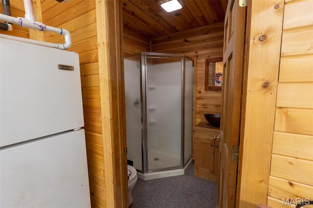 14035 County Road 4110, Rolla, MO 65401 - bathroom featuring a shower stall, wooden walls, toilet, and wooden ceiling