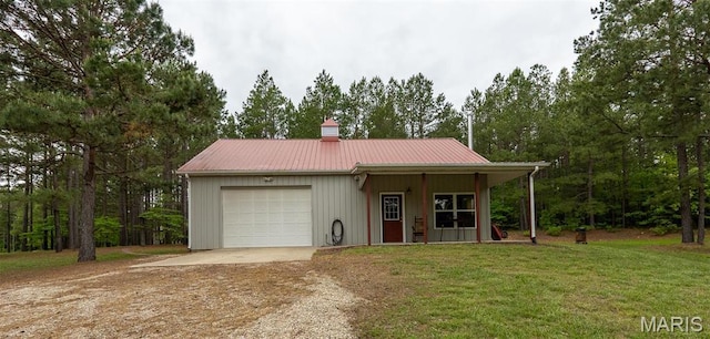 14035 County Road 4110, Rolla, MO 65401 - view of front of house with driveway, an attached garage, a front yard, a chimney, and metal roof