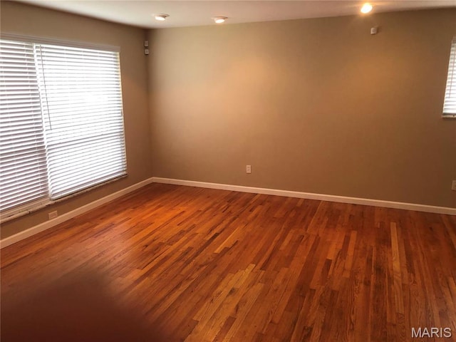 4501 San Francisco, San Francisco, Saint Louis, MO 63115 - spare room featuring dark wood finished floors and baseboards