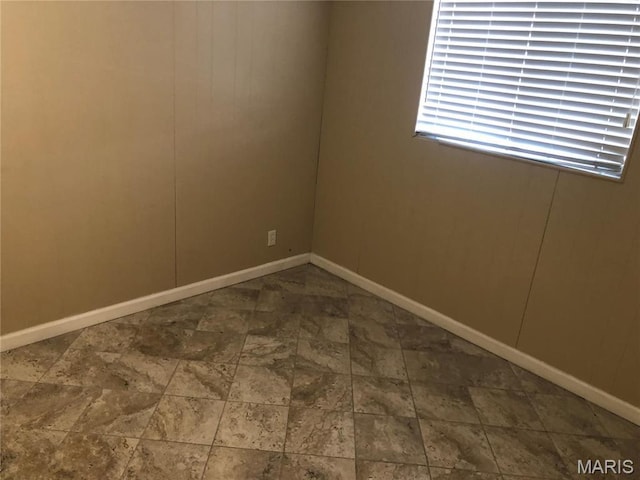 4501 San Francisco, San Francisco, Saint Louis, MO 63115 - spare room featuring baseboards and stone finish floors