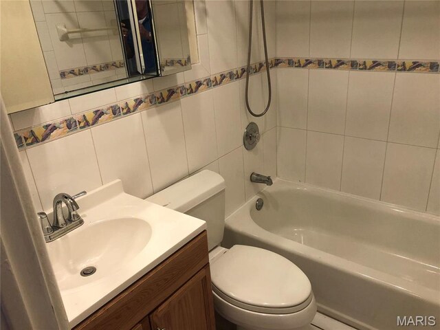 4501 San Francisco, San Francisco, Saint Louis, MO 63115 - bathroom with washtub / shower combination, vanity, and tile walls