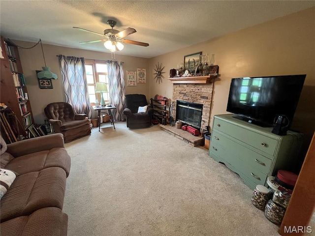 7070 Goldenrod Rd, Hannibal, MO 63401 - living area featuring ceiling fan, light carpet, a stone fireplace, and a textured ceiling