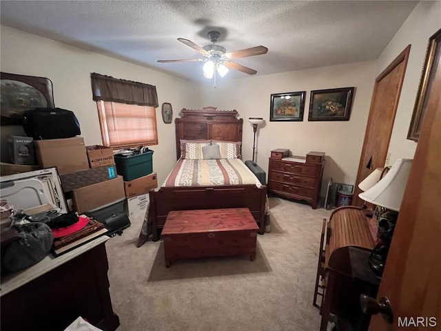 7070 Goldenrod Rd, Hannibal, MO 63401 - carpeted bedroom with a textured ceiling and a ceiling fan