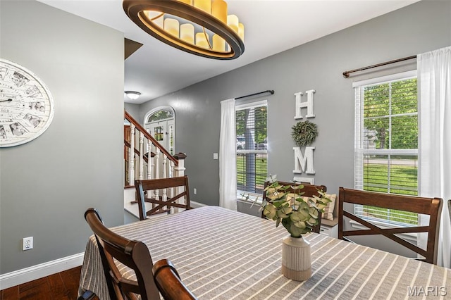 162 Saint Benedict, Pevely, MO 63070 - dining area featuring wood finished floors, baseboards, and stairs