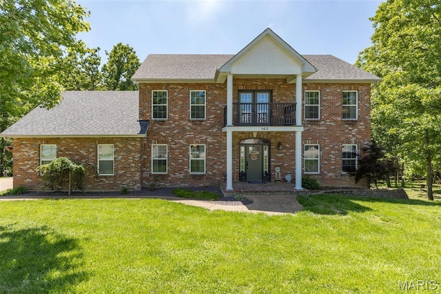 162 Saint Benedict, Pevely, MO 63070 - view of front of house featuring a balcony, a front lawn, and a shingled roof