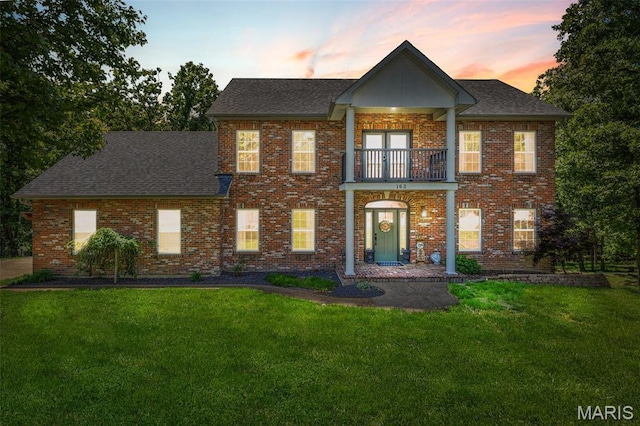 162 Saint Benedict, Pevely, MO 63070 - colonial home with a balcony, a lawn, a shingled roof, and brick siding