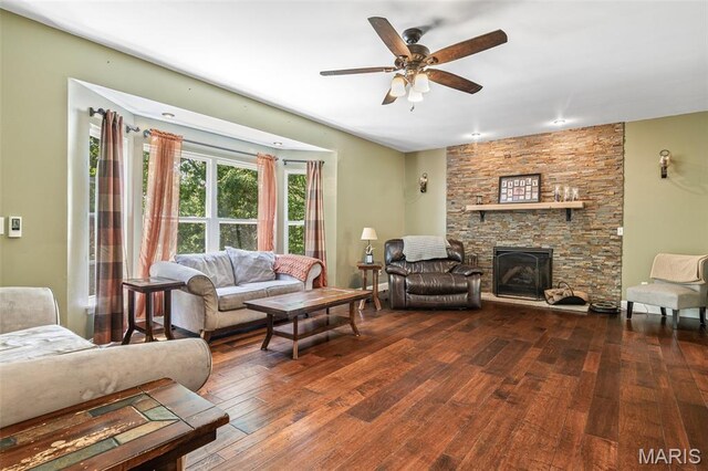 162 Saint Benedict, Pevely, MO 63070 - living room featuring wood finished floors, ceiling fan, and a stone fireplace