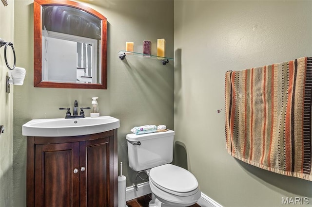 162 Saint Benedict, Pevely, MO 63070 - bathroom featuring toilet, baseboards, and vanity