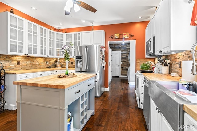 162 Saint Benedict, Pevely, MO 63070 - kitchen featuring butcher block countertops, stainless steel appliances, ceiling fan, dark wood finished floors, and recessed lighting