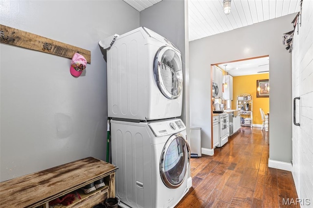 162 Saint Benedict, Pevely, MO 63070 - laundry room featuring estacked washer and dryer, dark wood-type flooring, and baseboards