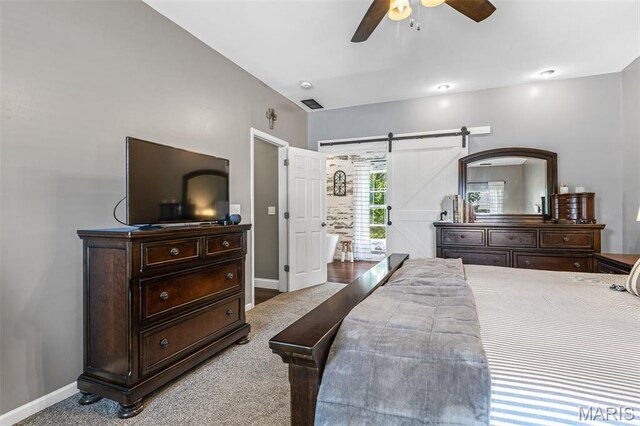 162 Saint Benedict, Pevely, MO 63070 - carpeted bedroom featuring a barn door, baseboards, and ceiling fan