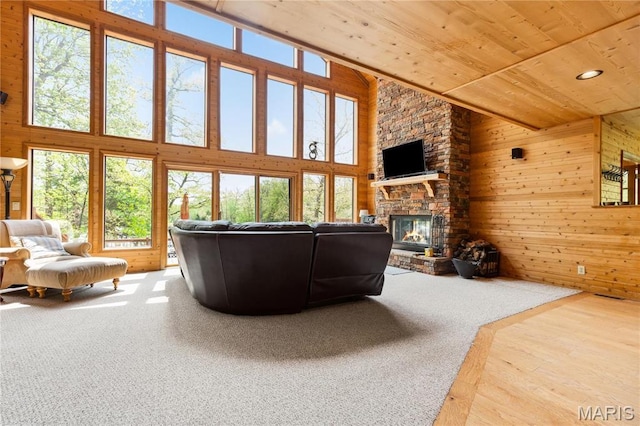 2635 Grendel Rdg, Innsbrook, MO 63390 - living room with wooden ceiling, plenty of natural light, wood walls, high vaulted ceiling, and a stone fireplace