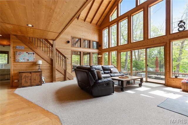 2635 Grendel Rdg, Innsbrook, MO 63390 - living room with wooden ceiling, high vaulted ceiling, wood walls, and stairway