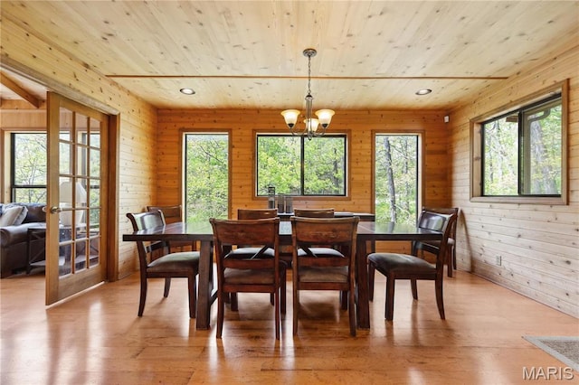 2635 Grendel Rdg, Innsbrook, MO 63390 - dining area with wood ceiling, plenty of natural light, wood walls, light wood-style flooring, and a chandelier