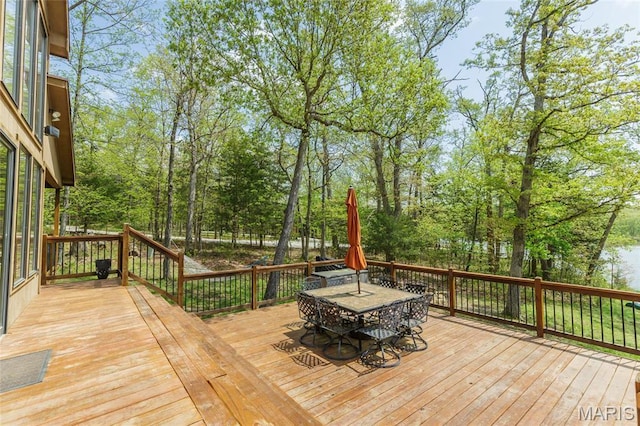 2635 Grendel Rdg, Innsbrook, MO 63390 - wooden terrace with outdoor dining area and view of scattered trees