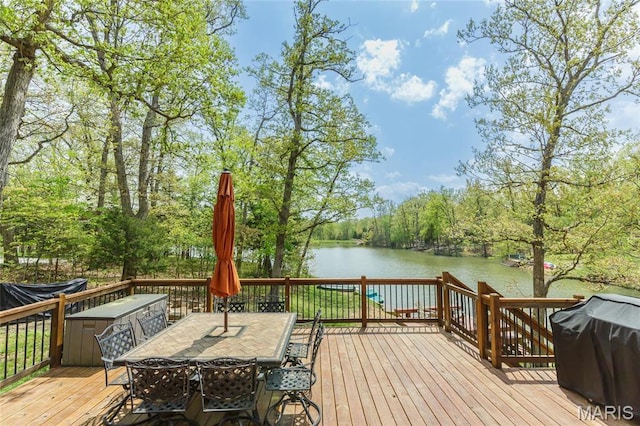 2635 Grendel Rdg, Innsbrook, MO 63390 - deck with a water view, outdoor dining area, area for grilling, and a view of trees