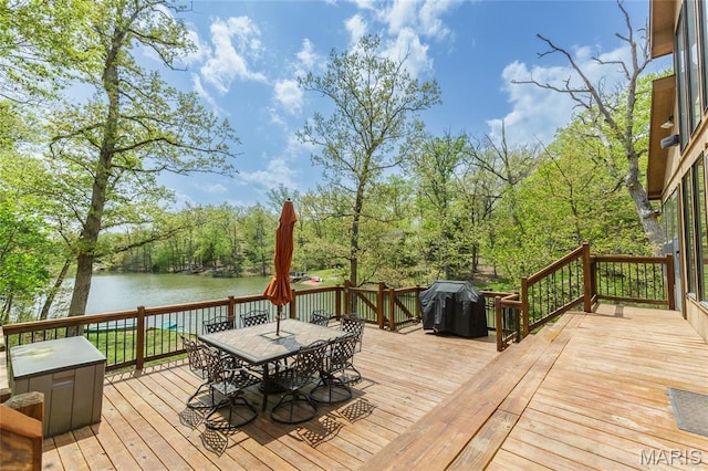 2635 Grendel Rdg, Innsbrook, MO 63390 - wooden terrace featuring outdoor dining space, a water view, and a grill