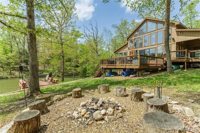 2635 Grendel Rdg, Innsbrook, MO 63390 - back of house with an outdoor fire pit, a deck, and stairway
