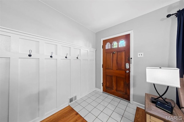 8452 S Laclede Station Rd, Saint Louis, MO 63123 - foyer with baseboards and light tile patterned flooring