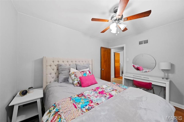 8452 S Laclede Station Rd, Saint Louis, MO 63123 - bedroom with ceiling fan and wood finished floors