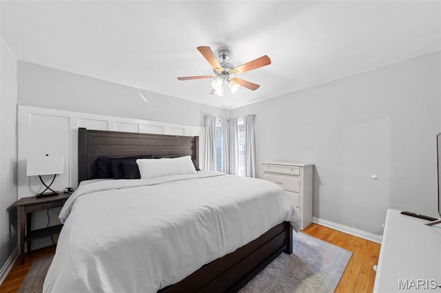 8452 S Laclede Station Rd, Saint Louis, MO 63123 - bedroom featuring baseboards, light wood finished floors, and ceiling fan